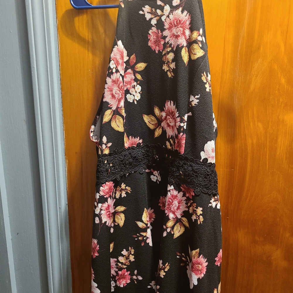 Floral dress, lace around middle, cut out back. Sleeveless
